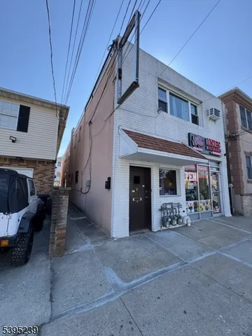 a view of a porch with furniture and a fireplace