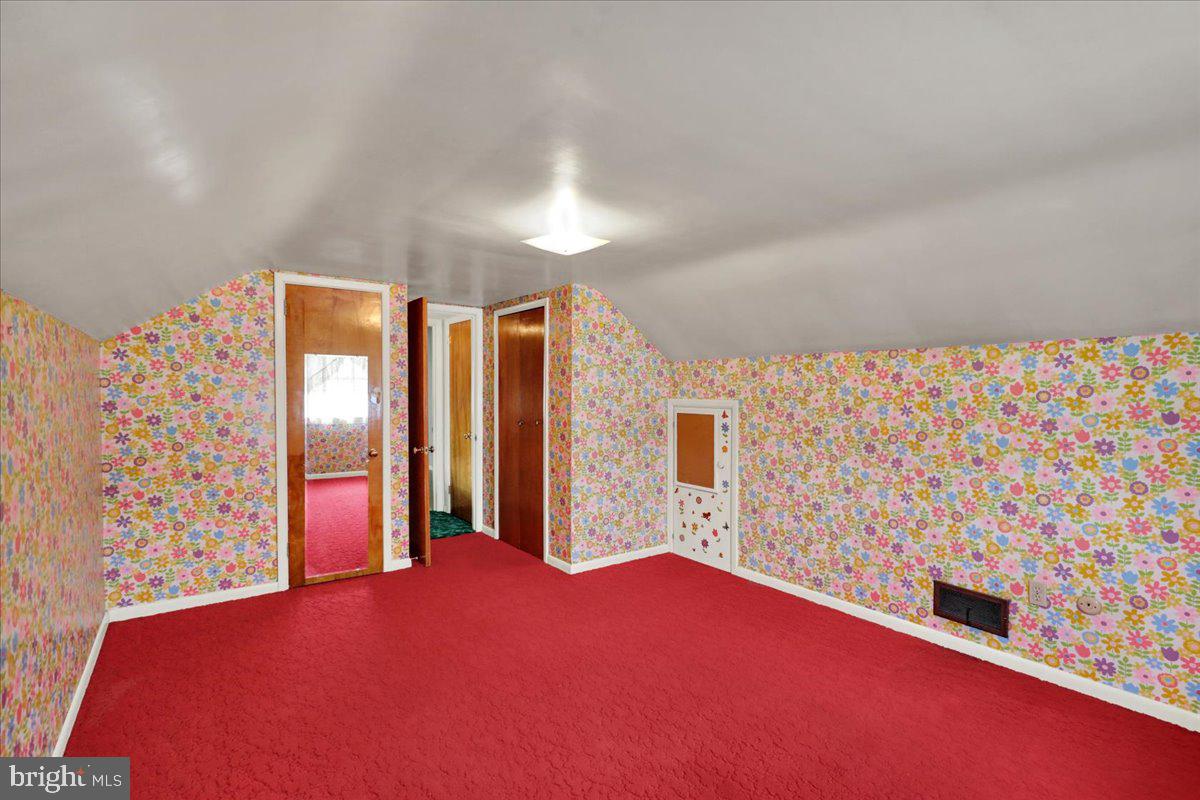 1224 Commonwealth Boulevard Reading, PA 19607 - Photo 21 of 27 a bedroom with a bed and a chandelier