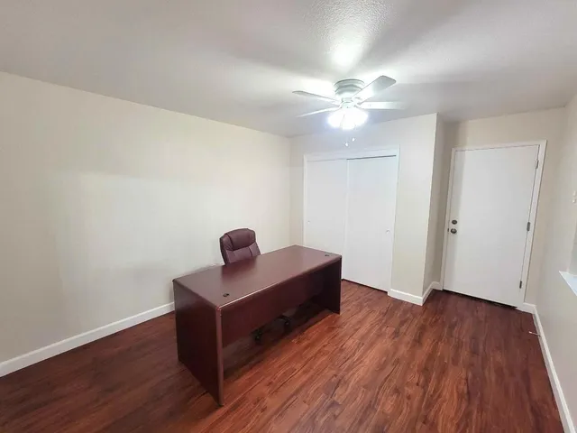 a view of room with wooden floor