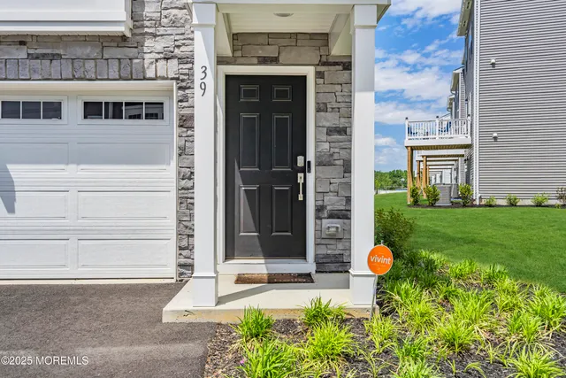 a view of a house with a street