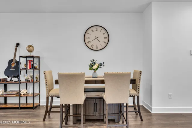 a bedroom with a large bed and a flat screen tv