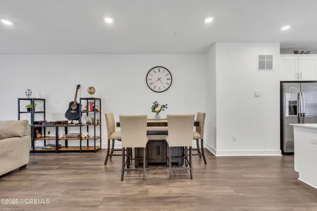 a bed sitting in a bedroom and flat screen tv