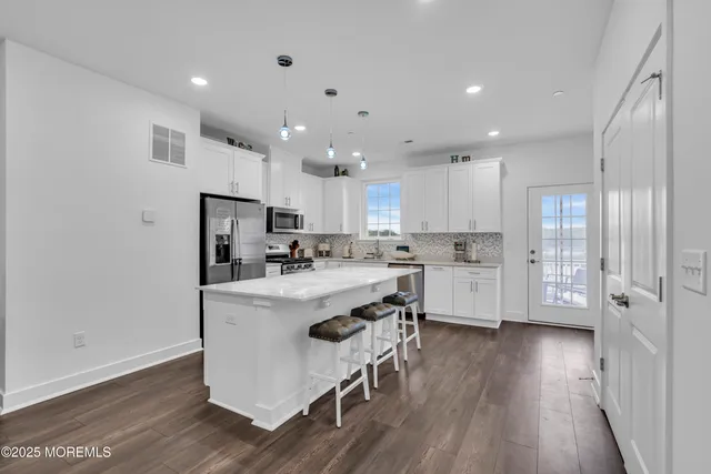 a spacious bedroom with a bed and a window