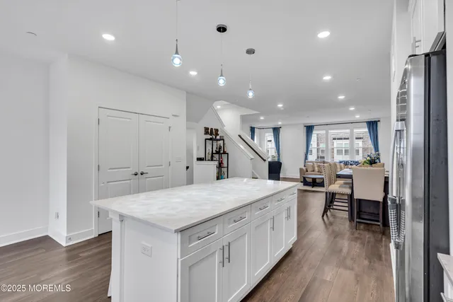 a bathroom with a granite countertop sink and mirror
