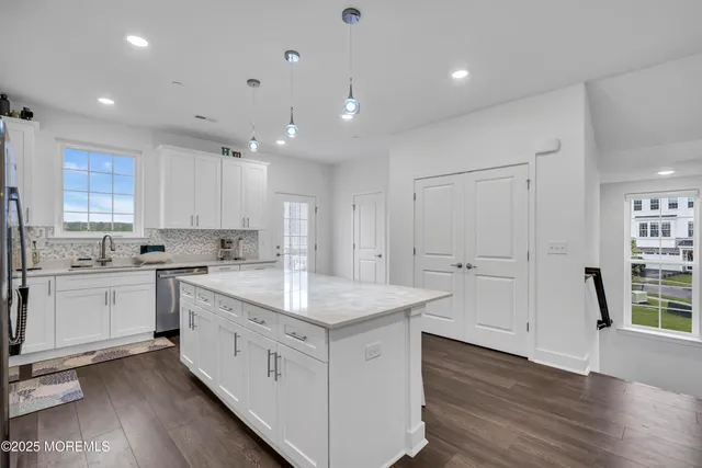 a bedroom with a bed and flat screen tv