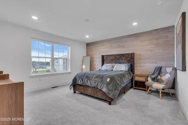 a view of an empty room with a flat screen tv