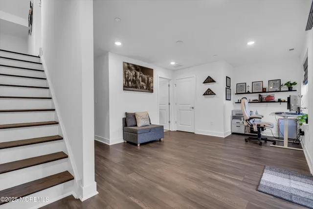 a view of a livingroom with workspace and a couch