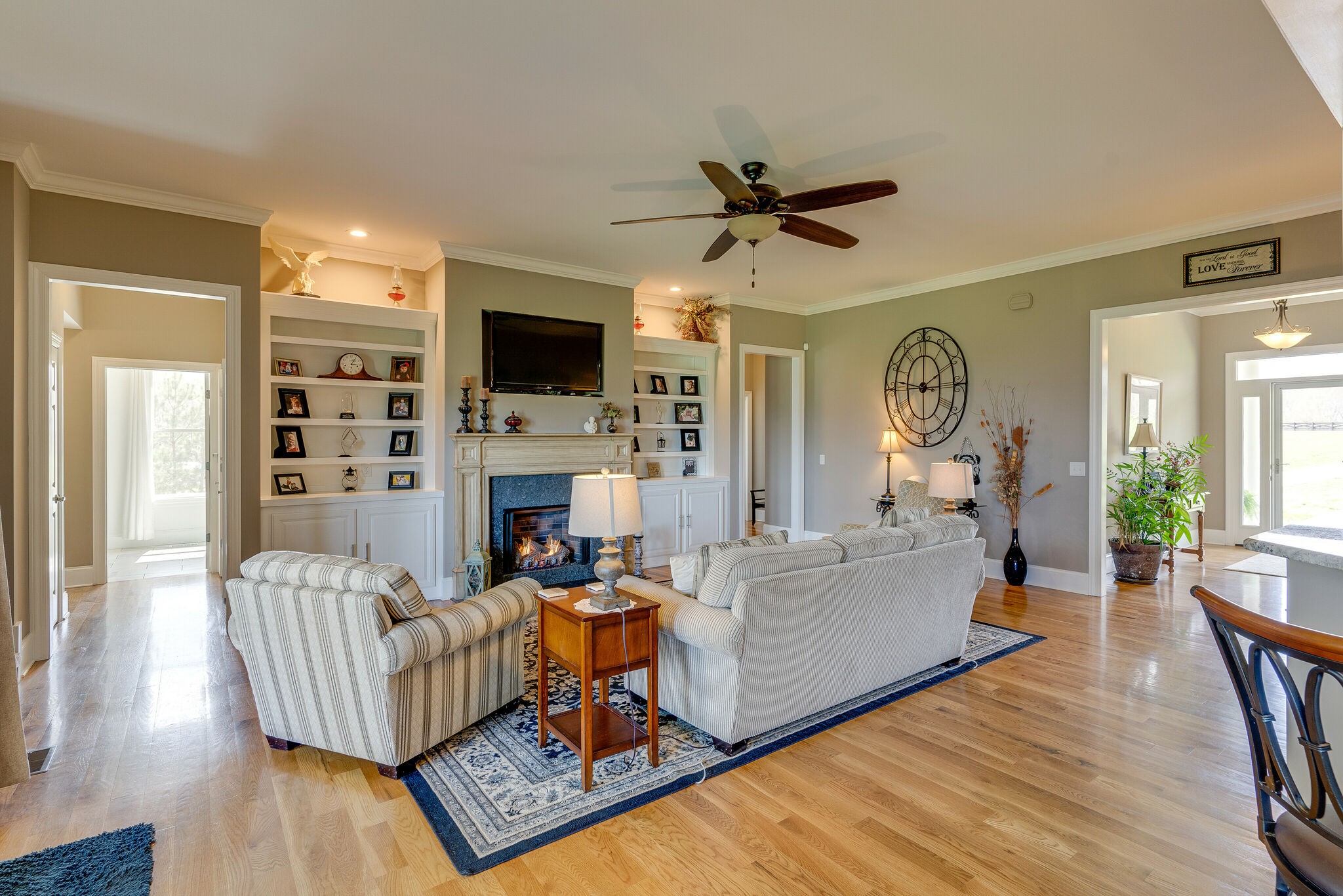 8882 New Chapel Road Springfield, TN 37172 - Photo 11 of 60 a living room with furniture fireplace and a flat screen tv