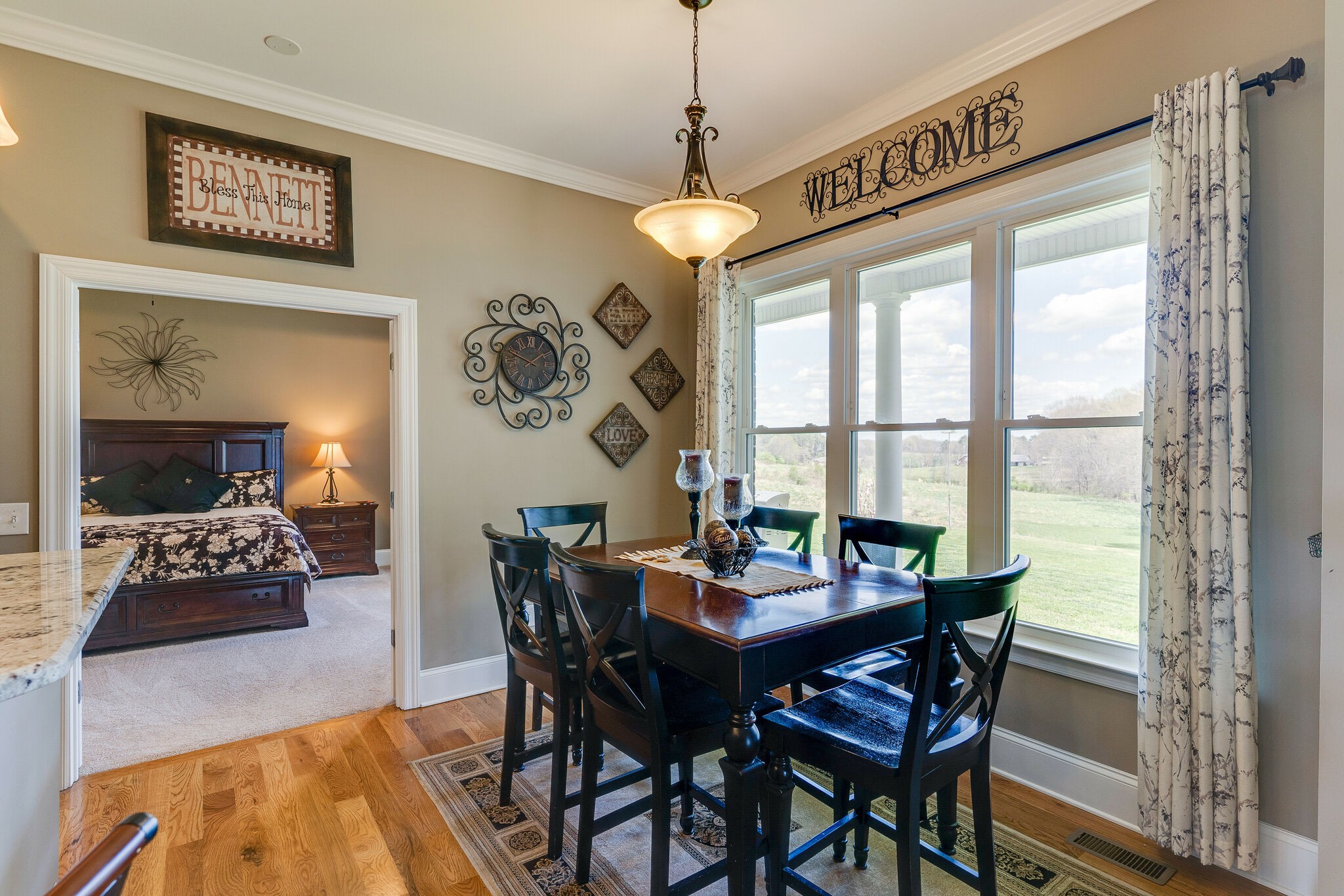 8882 New Chapel Road Springfield, TN 37172 - Photo 13 of 60 a view of a dining room with furniture window and wooden floor