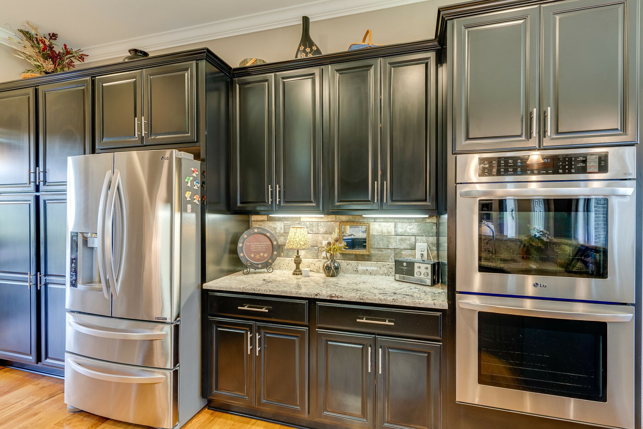 8882 New Chapel Road Springfield, TN 37172 - Photo 17 of 60 a kitchen with granite countertop a refrigerator stove and cabinets