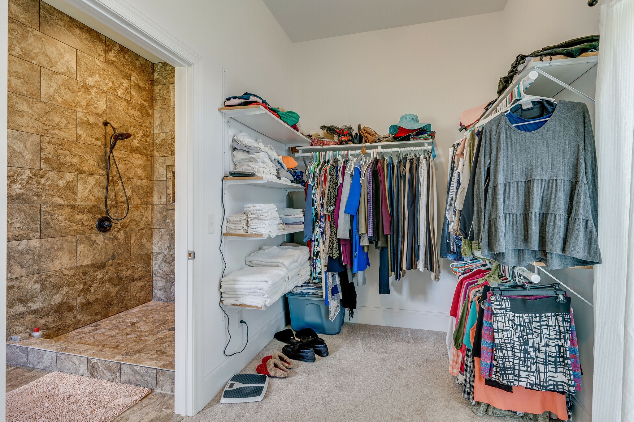 8882 New Chapel Road Springfield, TN 37172 - Photo 22 of 60 a view of walk in closet with clothes and shoes