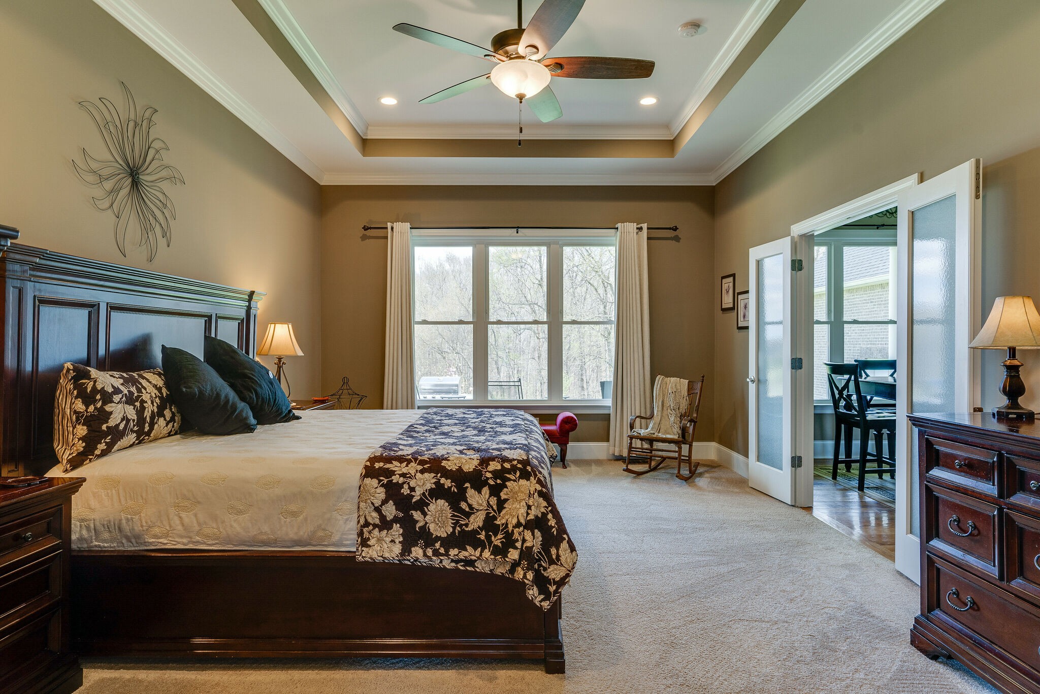 8882 New Chapel Road Springfield, TN 37172 - Photo 23 of 60 a bedroom with a large bed and a chandelier