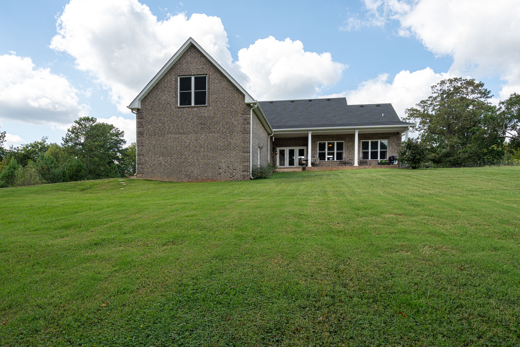 8882 New Chapel Road Springfield, TN 37172 - Photo 39 of 60 a view of a yard in front of a house with plants and large trees
