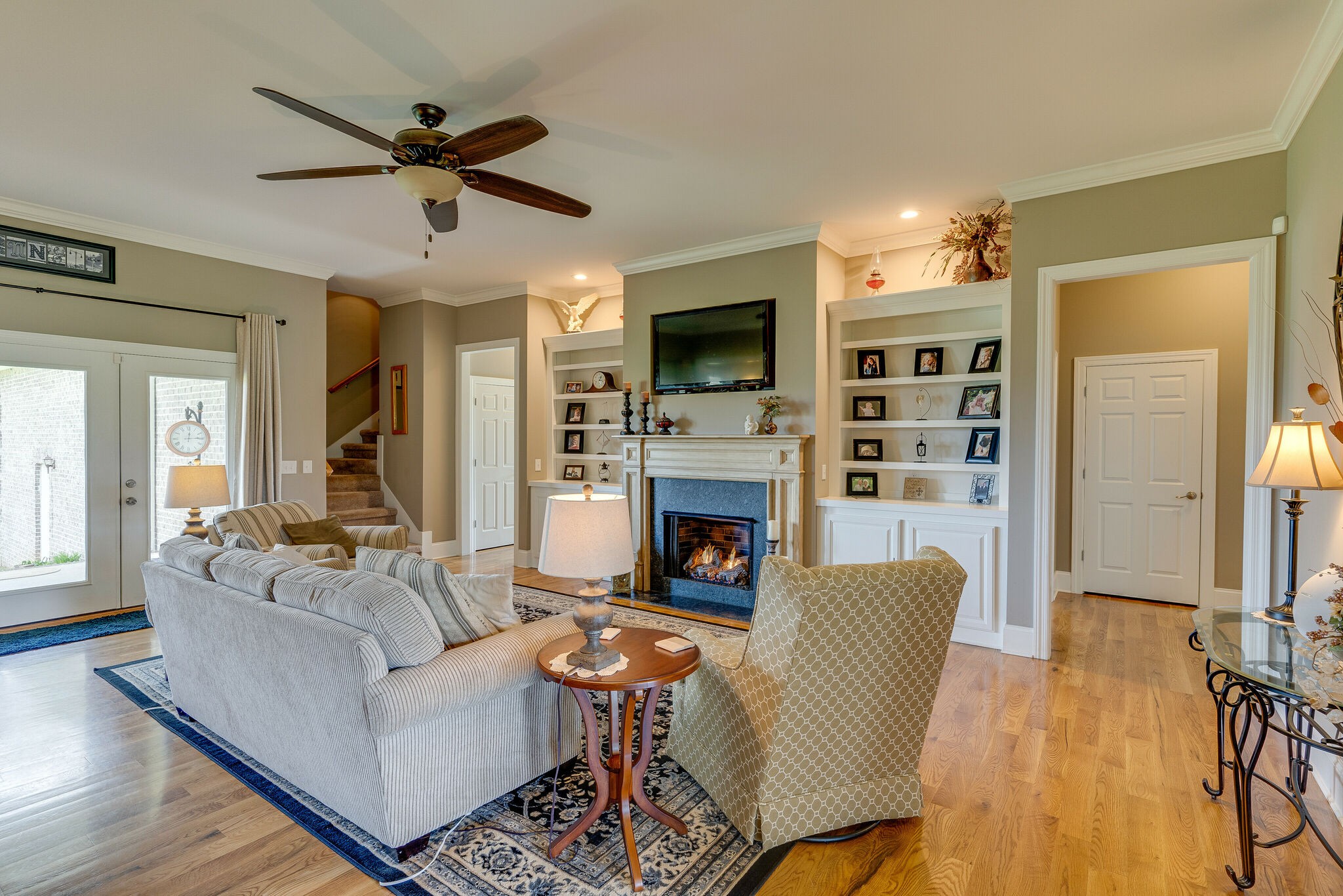 8882 New Chapel Road Springfield, TN 37172 - Photo 10 of 60 a living room with furniture a fireplace and a flat screen tv