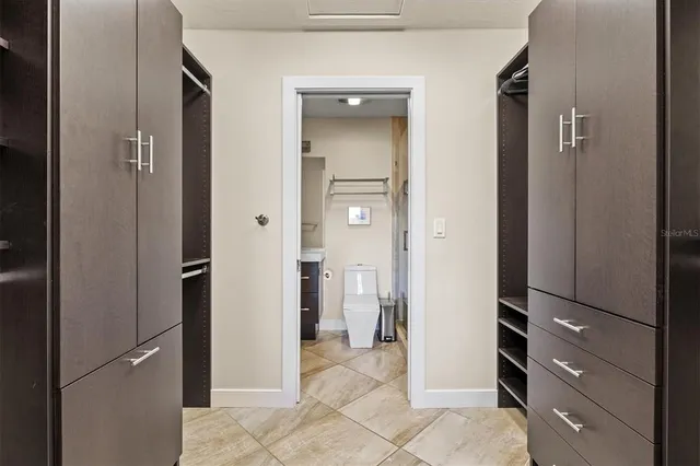 a balcony with table and chairs