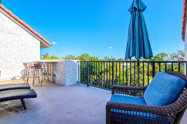 a patio with a table and chairs