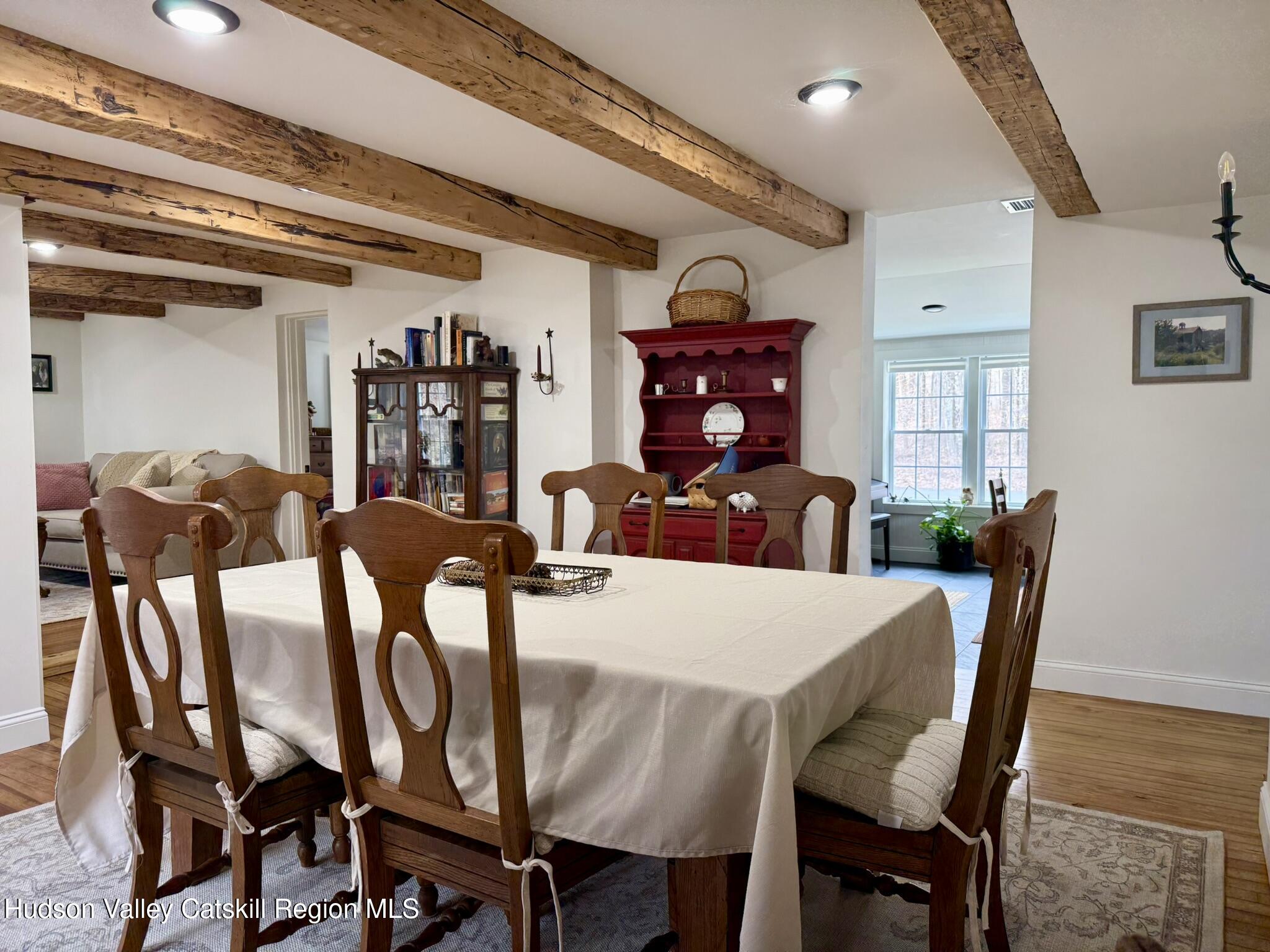96 West Deans Mill Road New Baltimore, NY 12192 - Photo 13 of 60 a view of a dining room with furniture and wooden floor