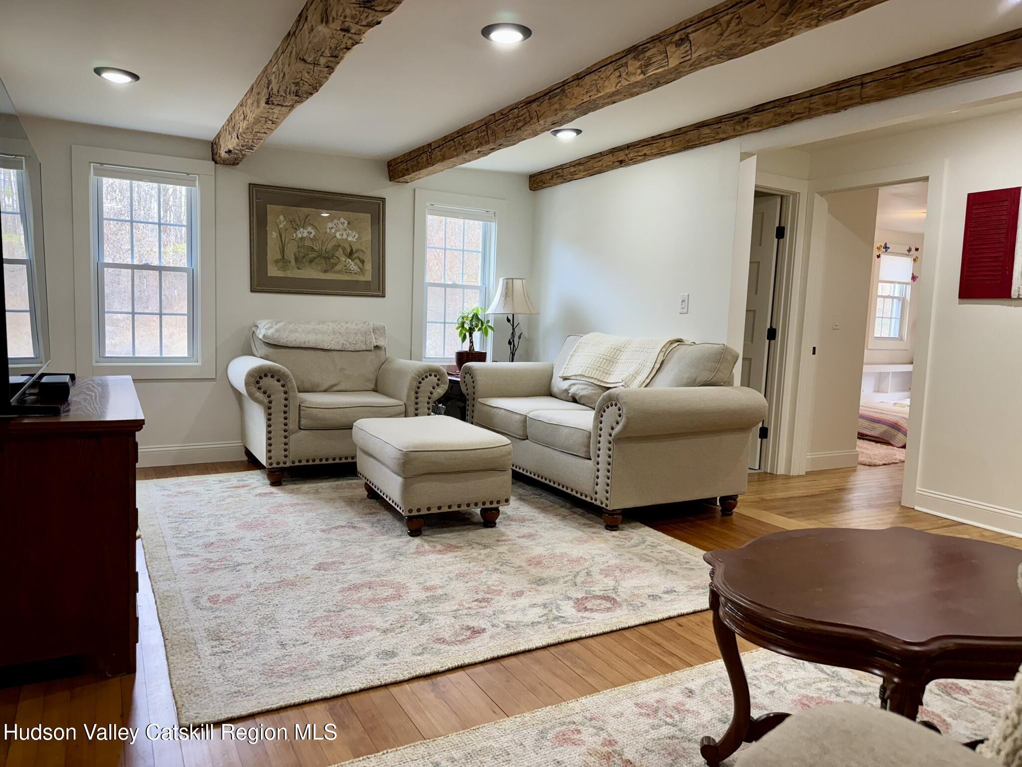 96 West Deans Mill Road New Baltimore, NY 12192 - Photo 16 of 60 a living room with furniture rug and window