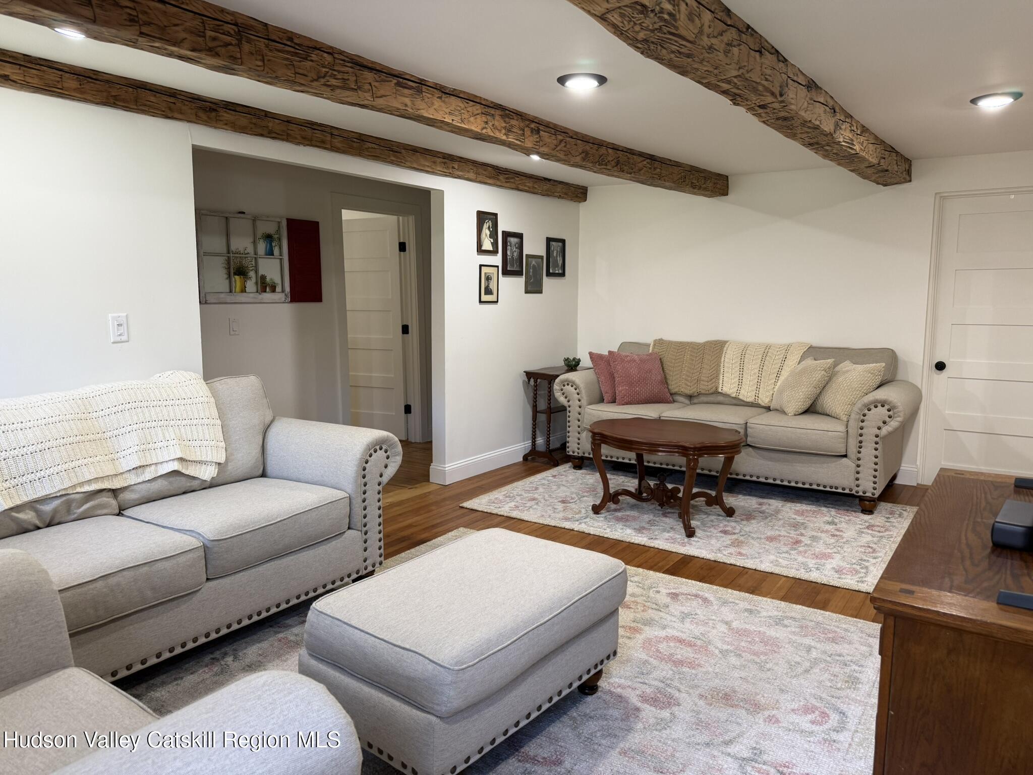 96 West Deans Mill Road New Baltimore, NY 12192 - Photo 18 of 60 a living room with furniture and a rug