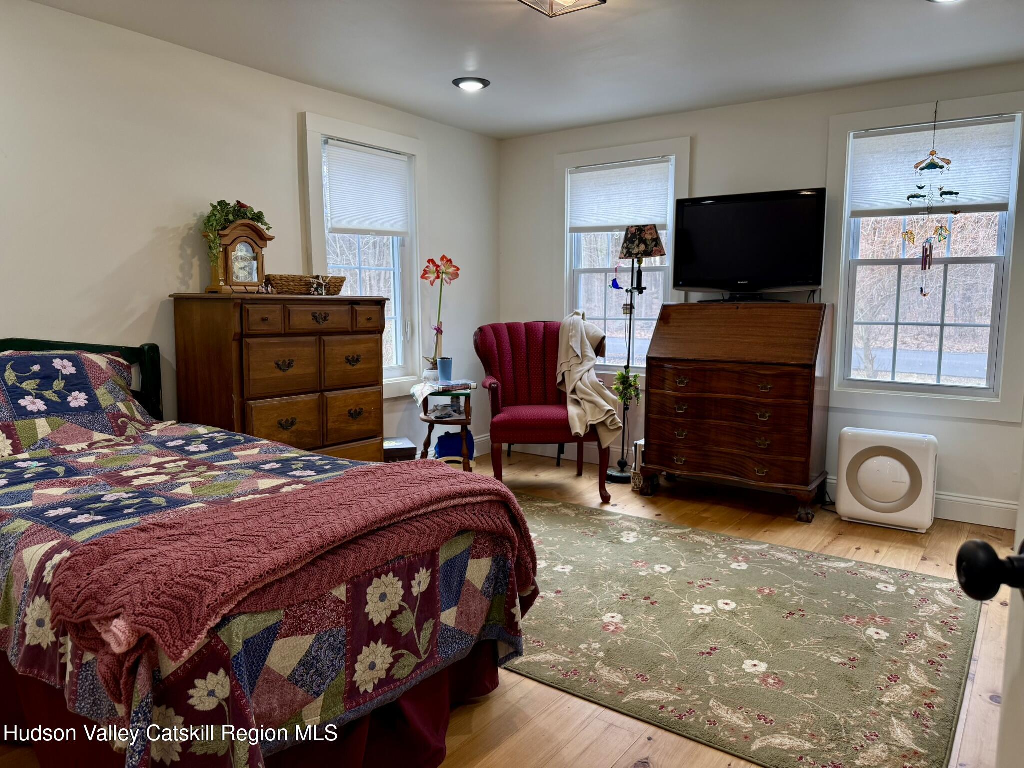 96 West Deans Mill Road New Baltimore, NY 12192 - Photo 20 of 60 a bedroom with a bed and furniture