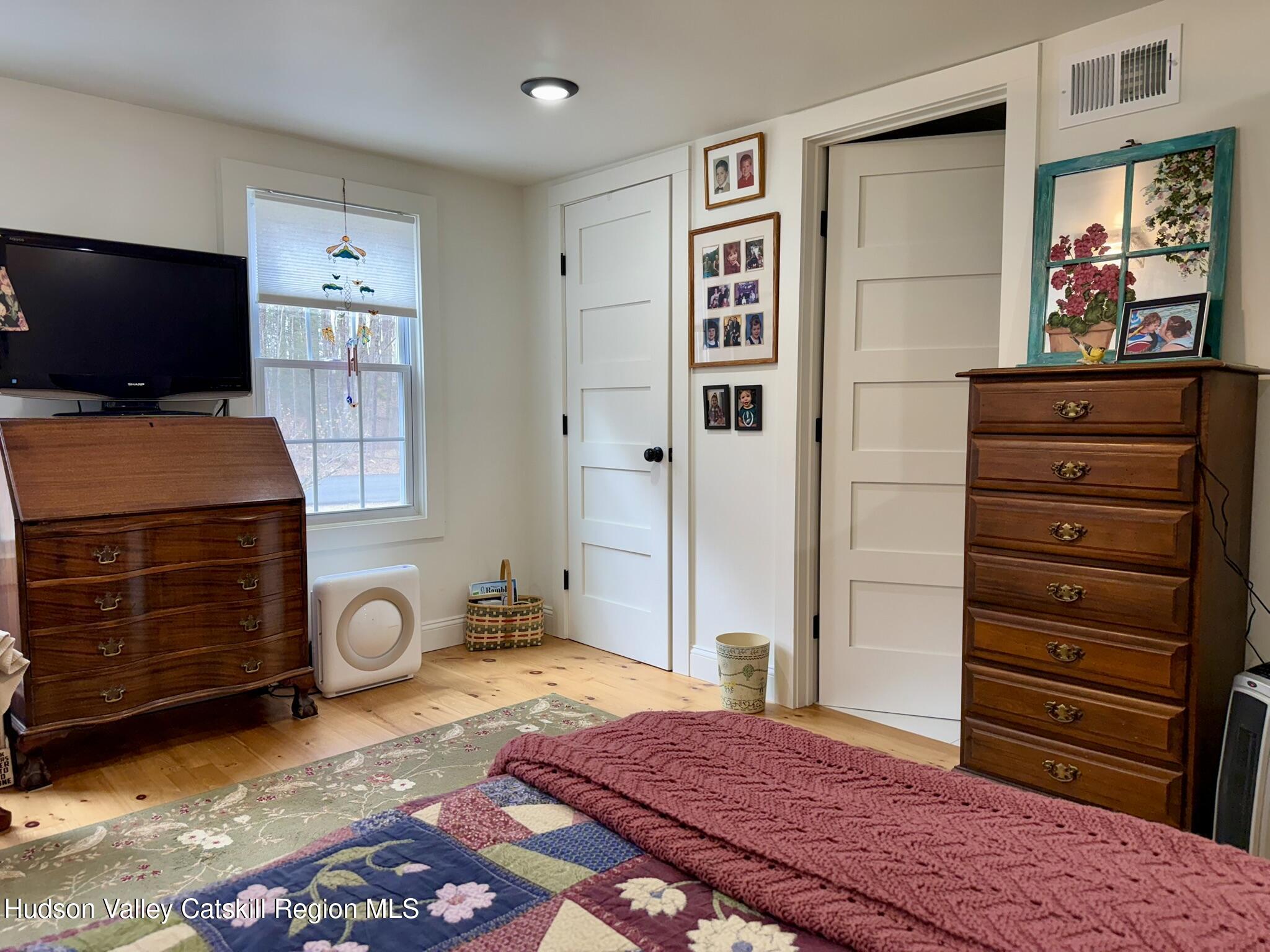 96 West Deans Mill Road New Baltimore, NY 12192 - Photo 21 of 60 a bedroom with a bed and furniture