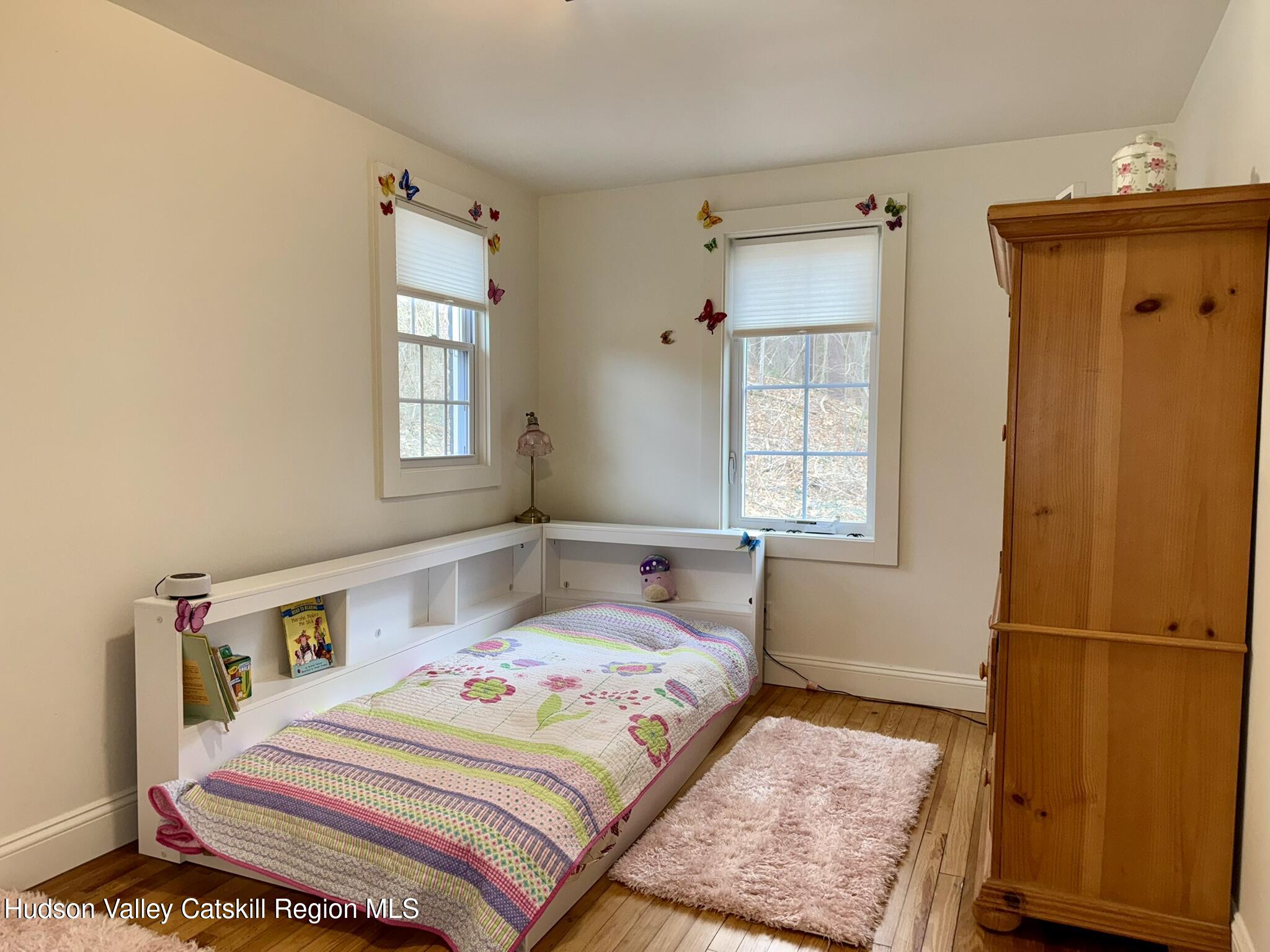 96 West Deans Mill Road New Baltimore, NY 12192 - Photo 28 of 60 a bedroom with a bed and a window