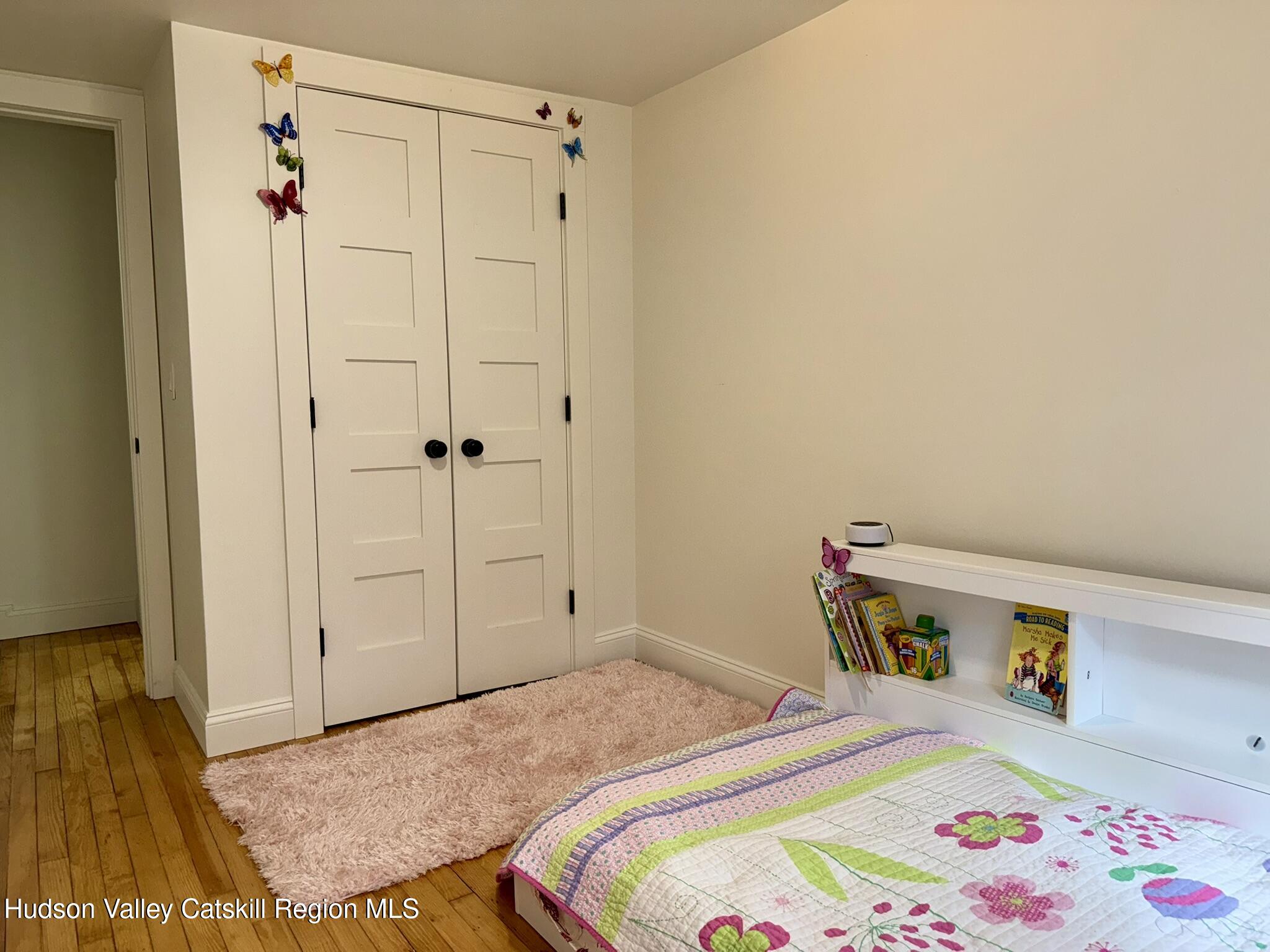 96 West Deans Mill Road New Baltimore, NY 12192 - Photo 30 of 60 a bedroom with a bed and a closet