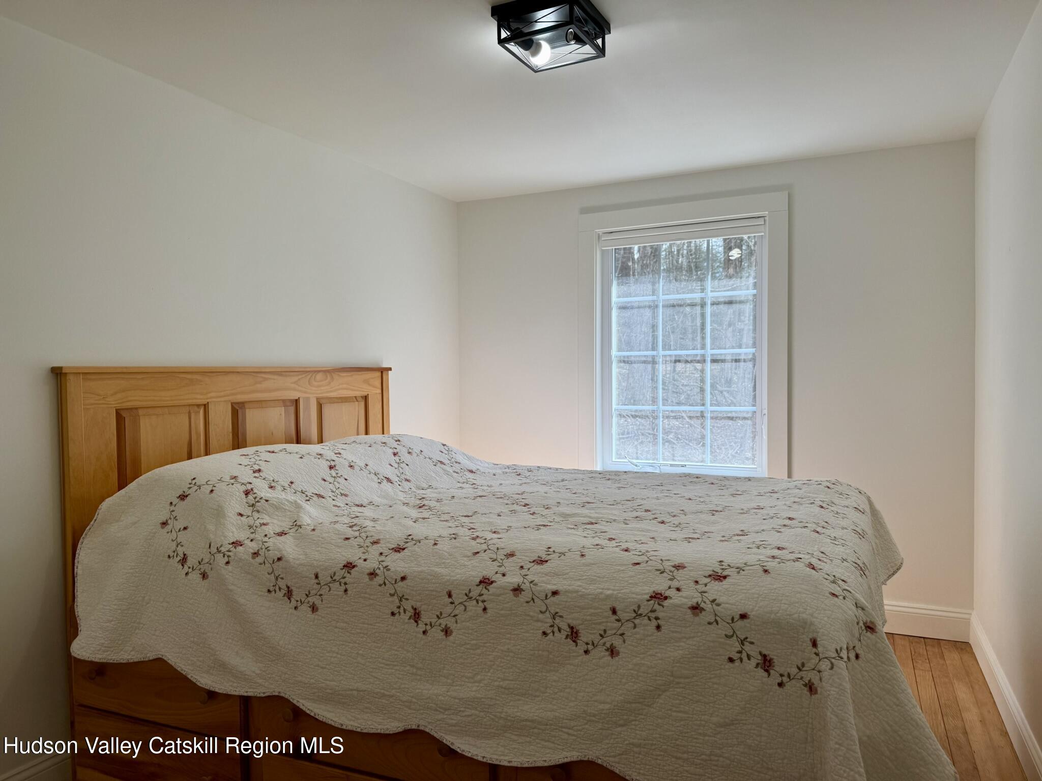 96 West Deans Mill Road New Baltimore, NY 12192 - Photo 31 of 60 a bedroom with a bed and dresser