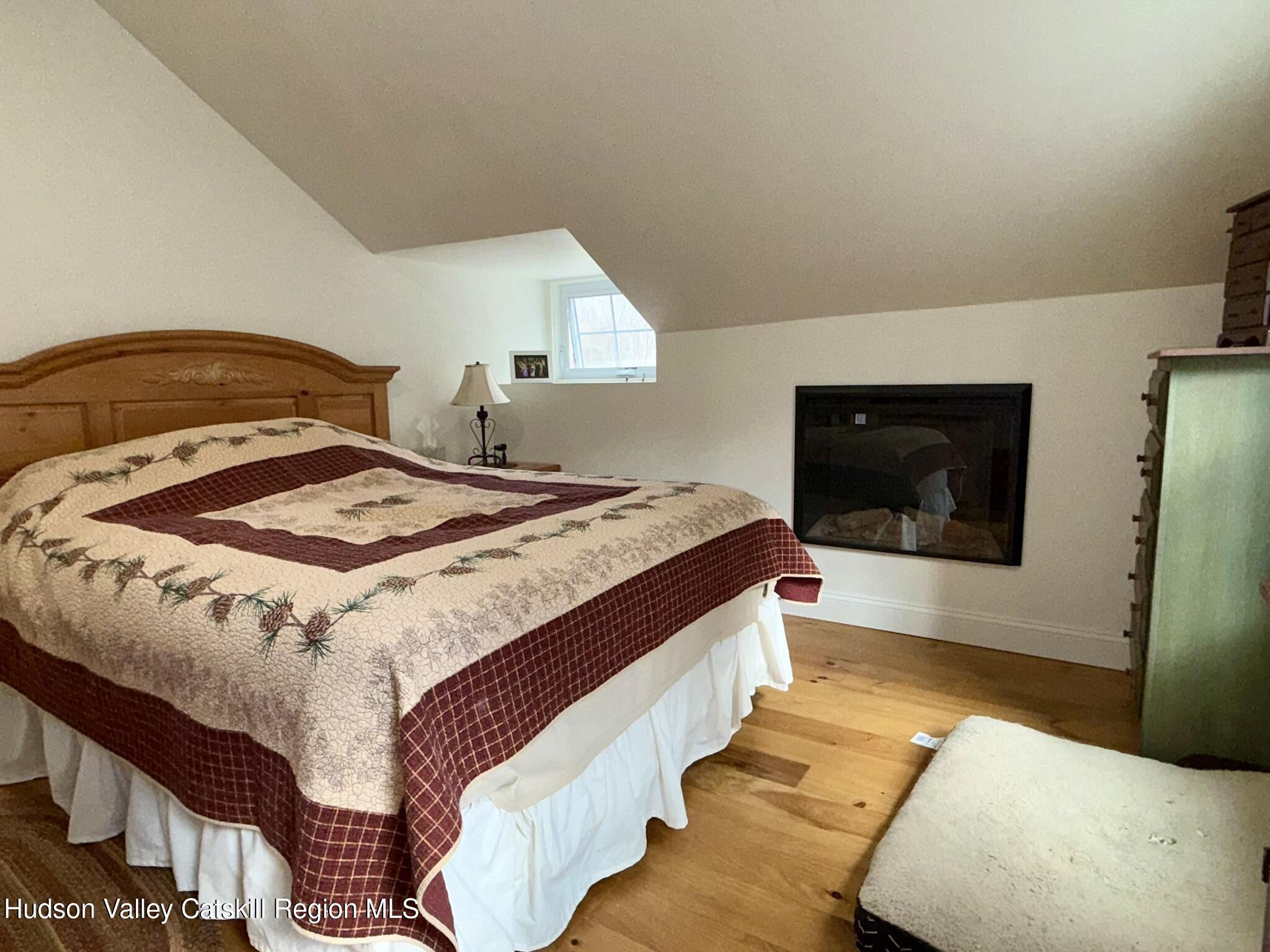 96 West Deans Mill Road New Baltimore, NY 12192 - Photo 37 of 60 a bedroom with a bed and walk in closet