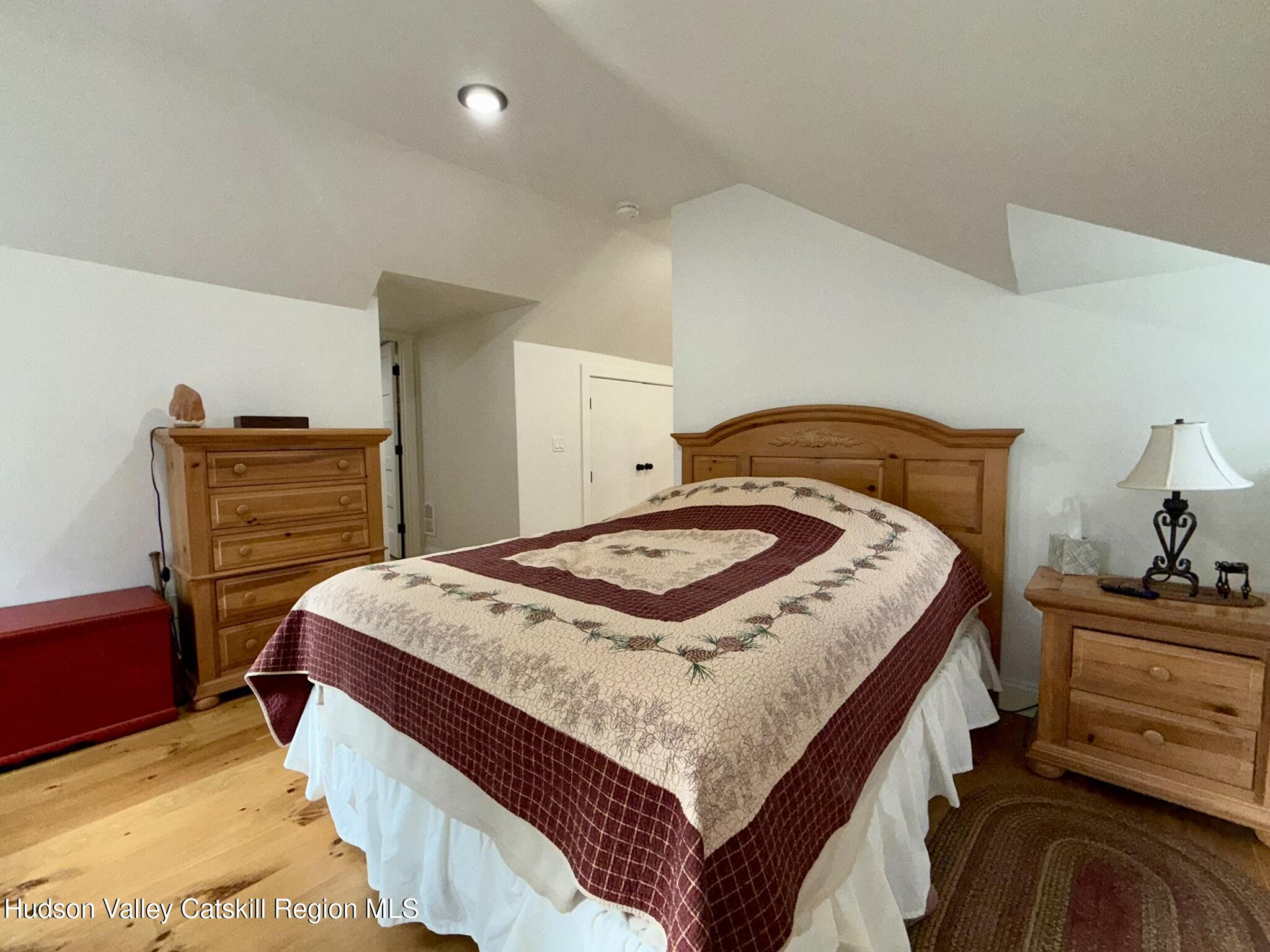 96 West Deans Mill Road New Baltimore, NY 12192 - Photo 38 of 60 a bedroom with a bed and dresser