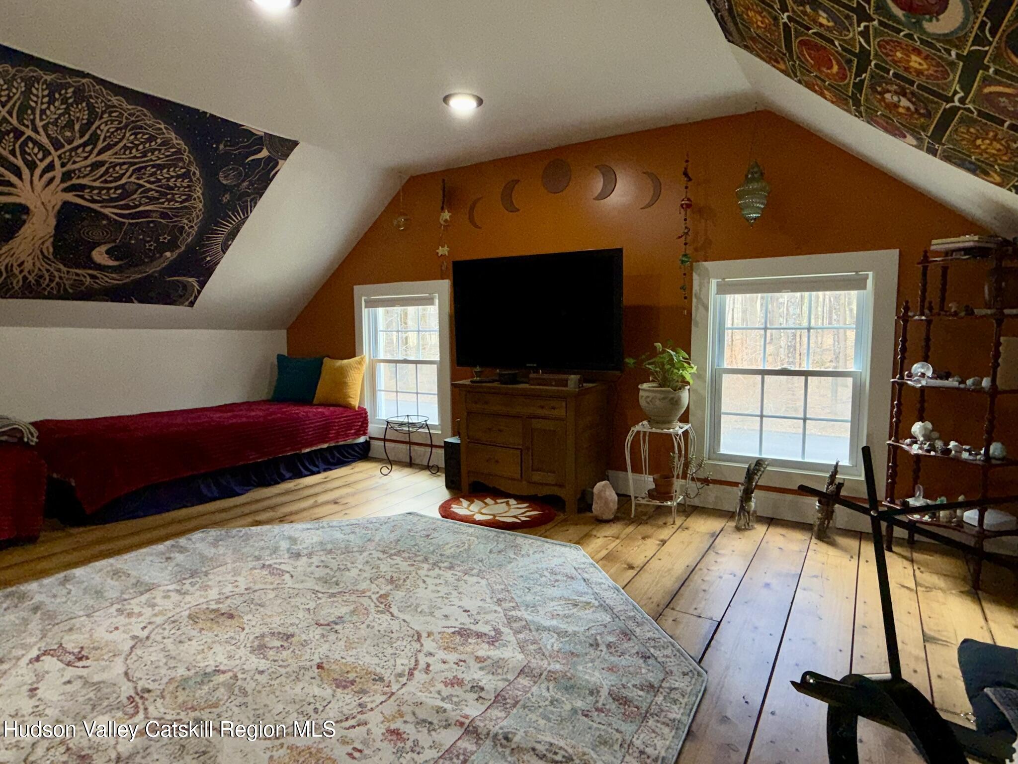 96 West Deans Mill Road New Baltimore, NY 12192 - Photo 39 of 60 a living room with furniture and a flat screen tv