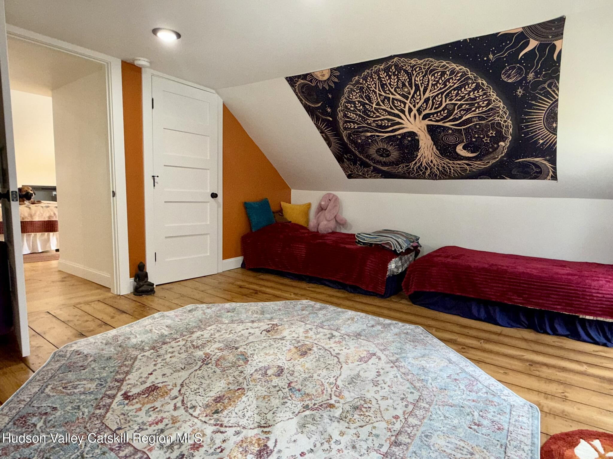 96 West Deans Mill Road New Baltimore, NY 12192 - Photo 41 of 60 a bedroom with a bed and a view of bathroom