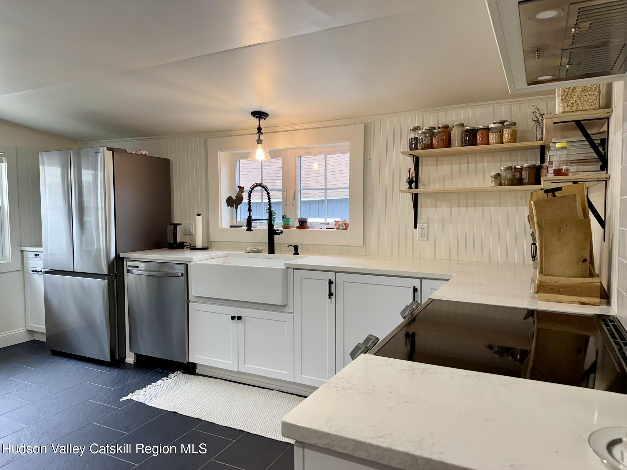 96 West Deans Mill Road New Baltimore, NY 12192 - Photo 10 of 60 a kitchen with a sink appliances and cabinets