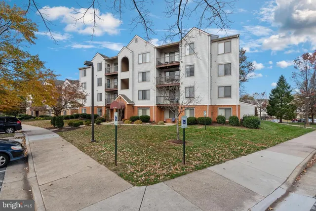 a view of a building with a yard
