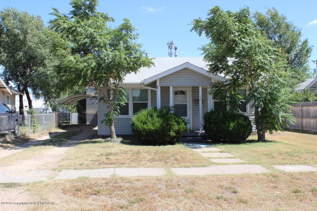3405 South Taylor Street Amarillo, TX 79110 - Photo 1 of 26 a front view of a house with a yard