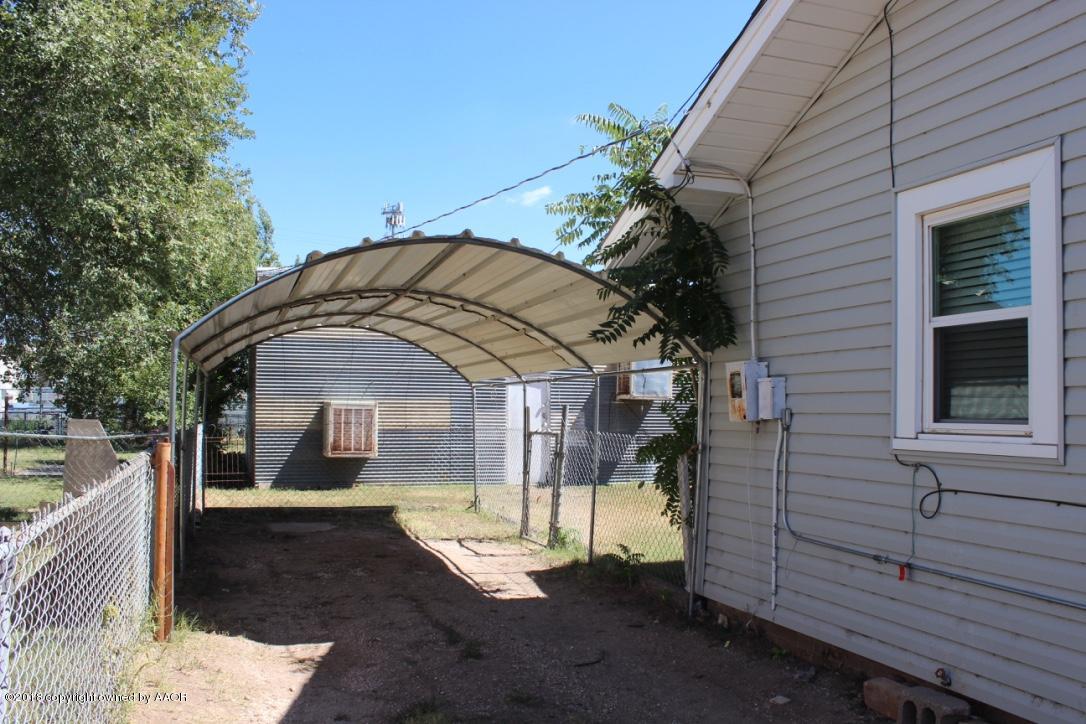 3405 South Taylor Street Amarillo, TX 79110 - Photo 13 of 26 a view of a house with a yard