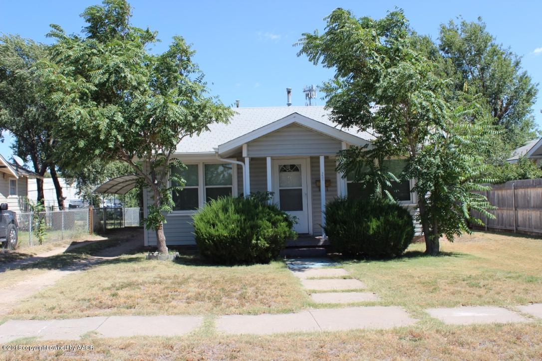 3405 South Taylor Street Amarillo, TX 79110 - Photo 2 of 26 a front view of a house with a garden