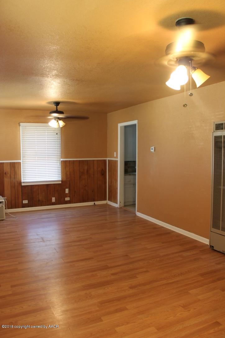 3405 South Taylor Street Amarillo, TX 79110 - Photo 5 of 26 a view of empty room with wooden floor