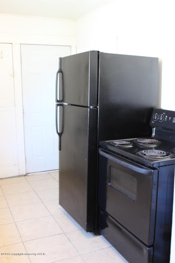 3405 South Taylor Street Amarillo, TX 79110 - Photo 8 of 26 a metallic refrigerator freezer sitting in a kitchen