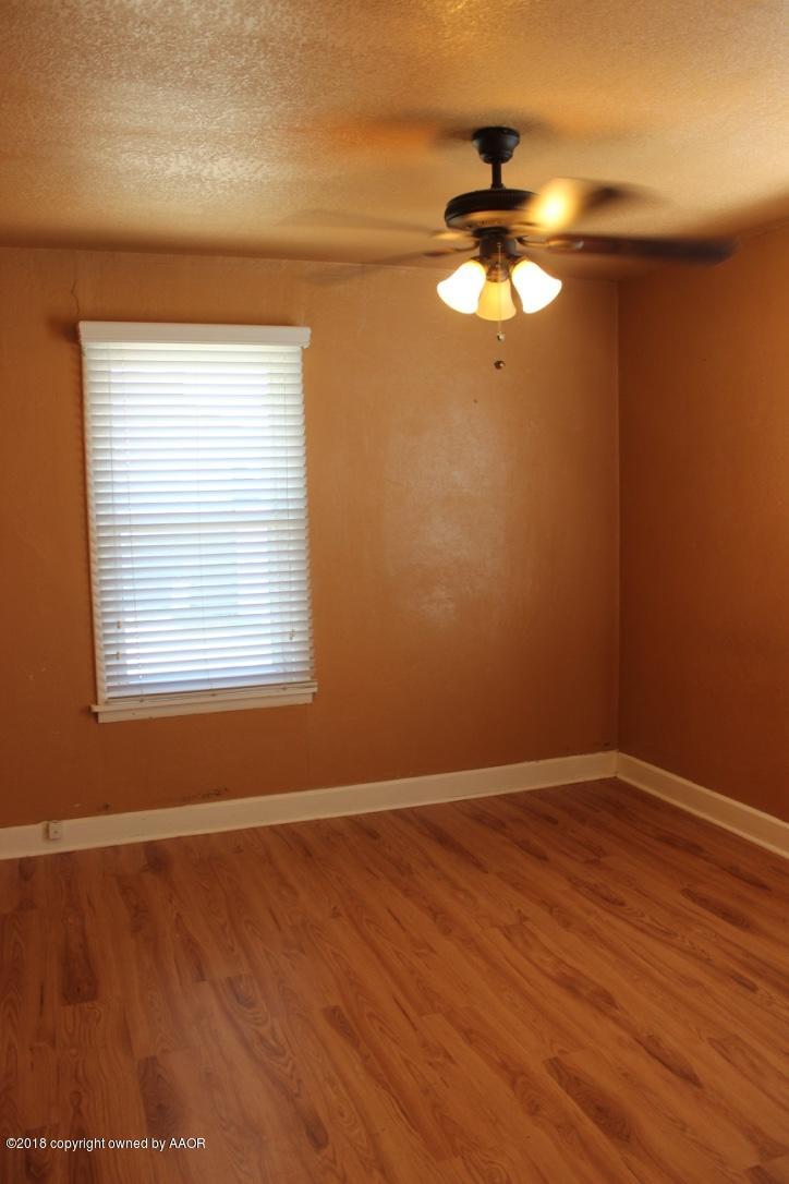 3405 South Taylor Street Amarillo, TX 79110 - Photo 10 of 26 wooden floor in an empty room