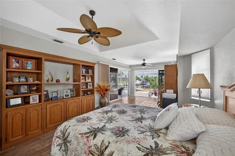 a bedroom with a large bed and a large window