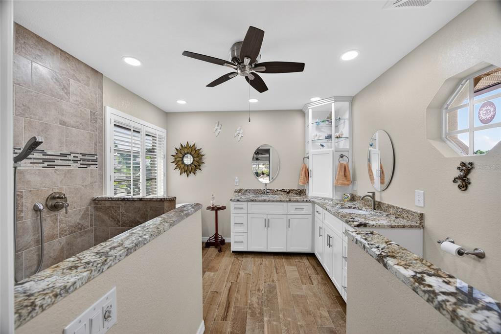3612 Whippoorwill Boulevard Punta Gorda, FL 33950 - Photo 17 of 40 a large kitchen with stainless steel appliances granite countertop a sink and stove