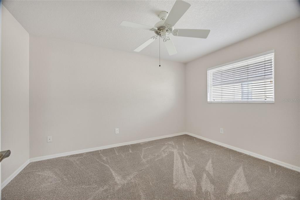3612 Whippoorwill Boulevard Punta Gorda, FL 33950 - Photo 20 of 40 an empty room with a window and a fan