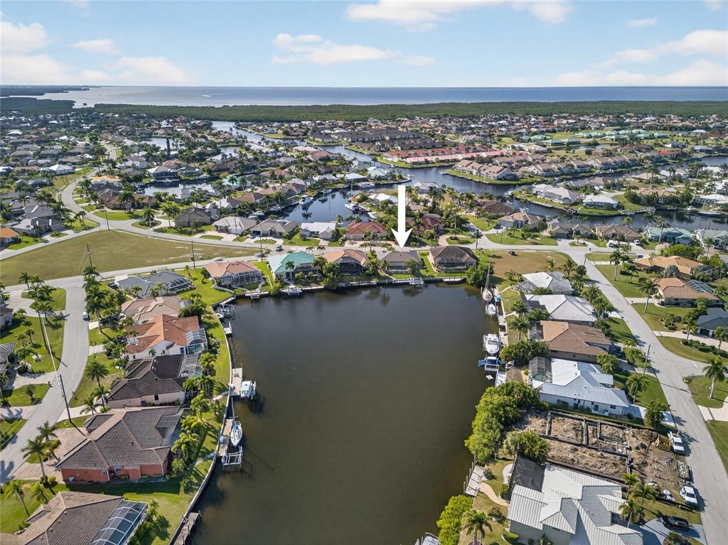 3612 Whippoorwill Boulevard Punta Gorda, FL 33950 - Photo 2 of 40 an aerial view of a city with ocean view