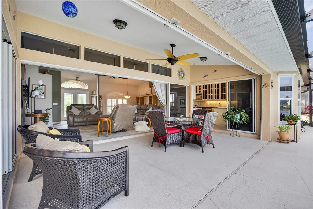 3612 Whippoorwill Boulevard Punta Gorda, FL 33950 - Photo 24 of 40 a living room with furniture table and chairs