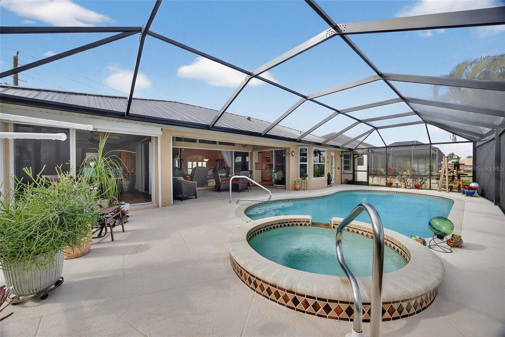 3612 Whippoorwill Boulevard Punta Gorda, FL 33950 - Photo 27 of 40 a view of a house with swimming pool and sitting area