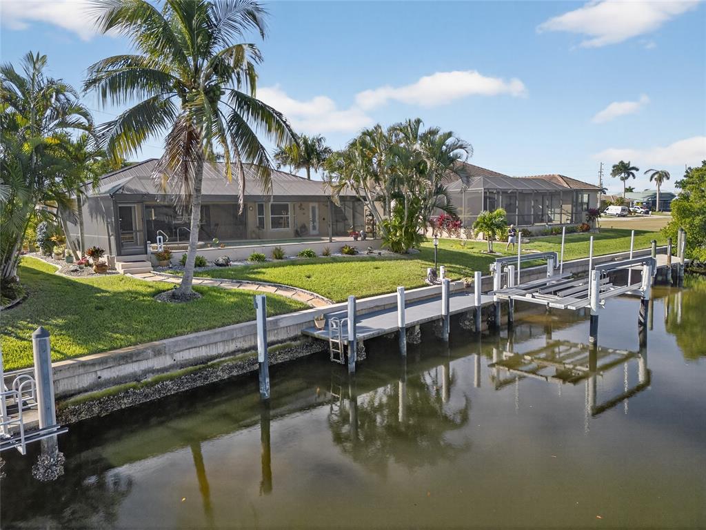 3612 Whippoorwill Boulevard Punta Gorda, FL 33950 - Photo 31 of 40 a view of a swimming pool with chairs