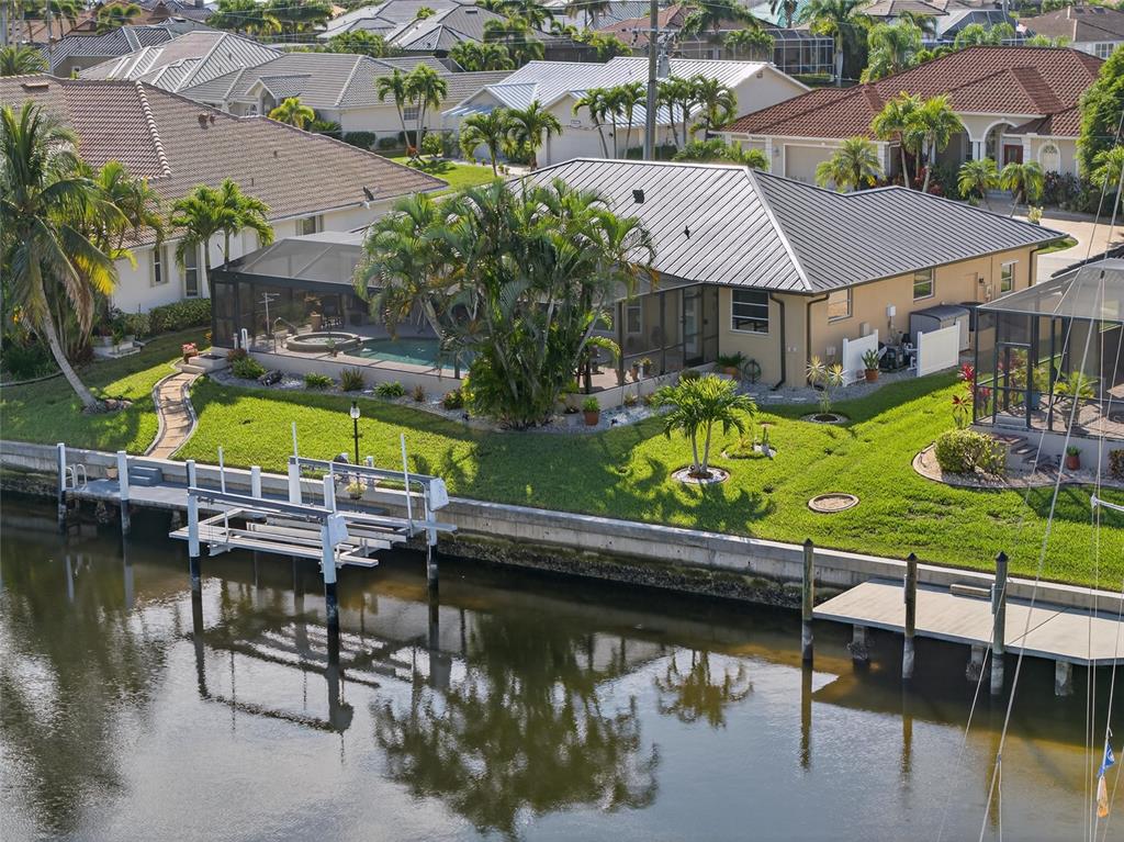 3612 Whippoorwill Boulevard Punta Gorda, FL 33950 - Photo 33 of 40 a view of swimming pool with outdoor seating and a garden