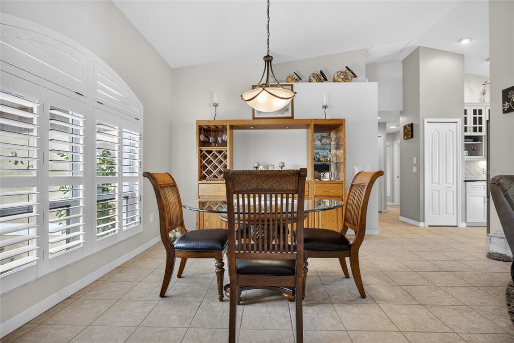 3612 Whippoorwill Boulevard Punta Gorda, FL 33950 - Photo 9 of 40 a view of a dining room with furniture window and wooden floor
