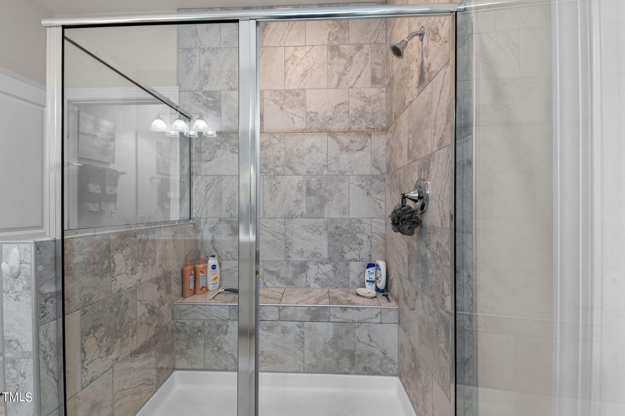 190 Azure Mist Drive Raleigh, NC 27610 - Photo 22 of 39 a bathroom with a glass shower door